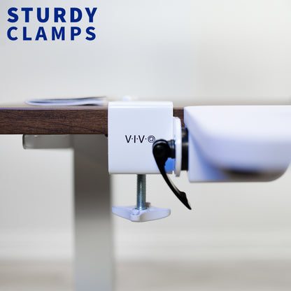 Sturdy clamps holding a wooden board.
