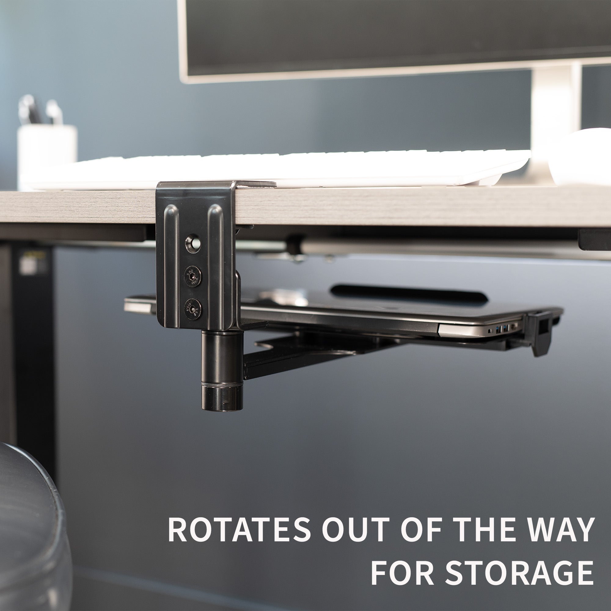 Rotates out of the way and can be used for storage