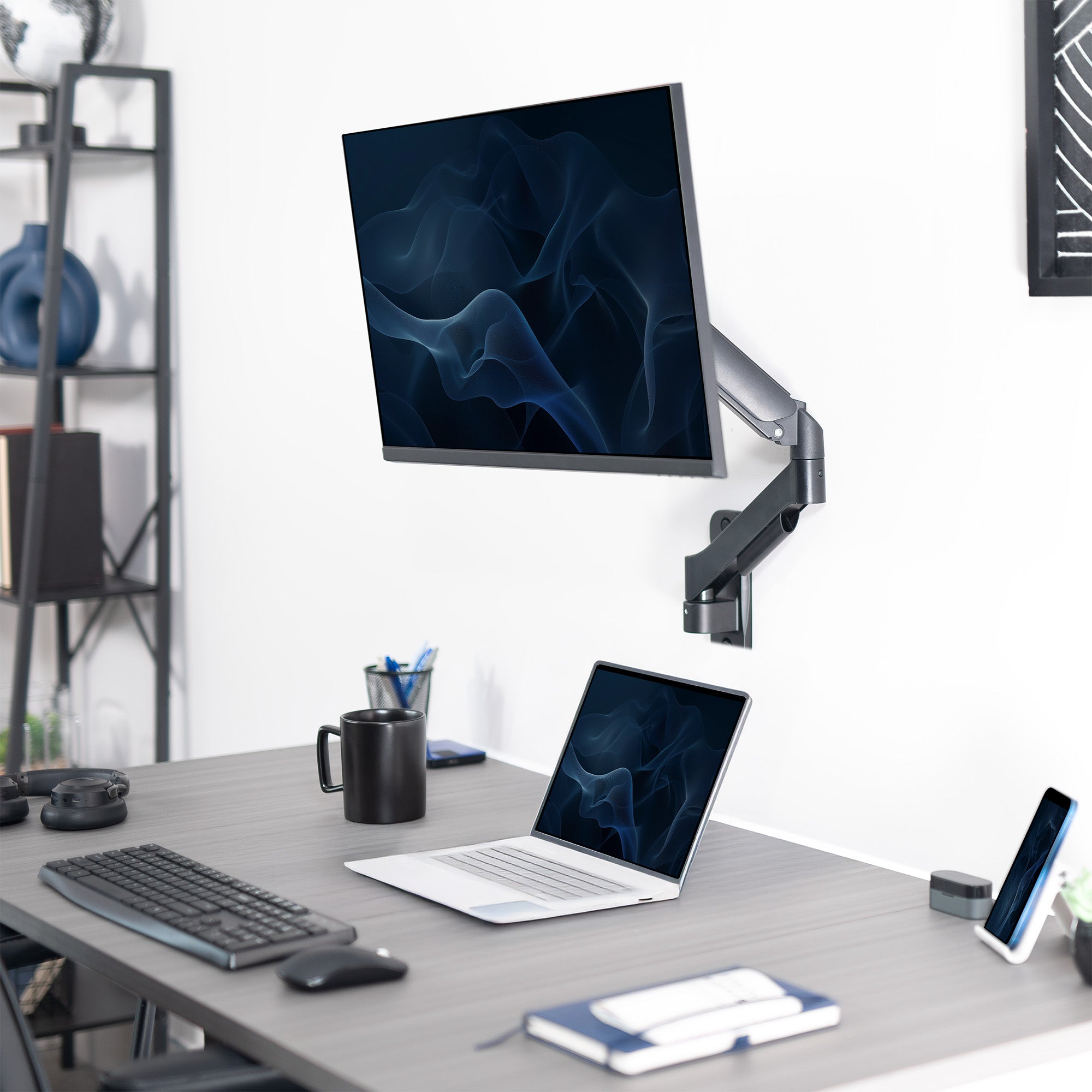 Sturdy adjustable mechanical arm single monitor ergonomic wall mount for office workstation.