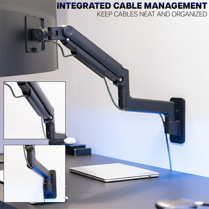 Wall-mounted monitor arm with integrated cable management system on a desk.