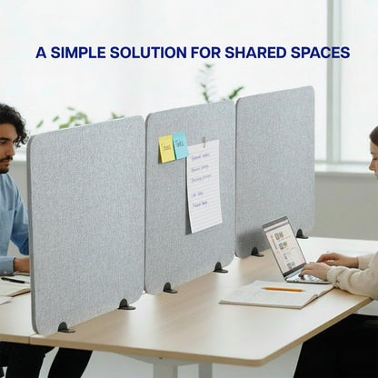 Gray desk privacy panel with people working at a table in an office setting.