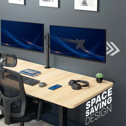 Modern office setup with dual monitors on a desk, chair, and decor.