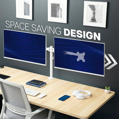 A modern home office setup with a light wood desk, gray office chair, dual monitors on adjustable white clamp-on desk mount, and a dark gray wall with framed art and the text 'SPACE SAVING DESIGN'.