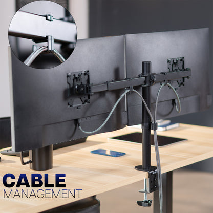 Monitor stand with cable management system on a desk, featuring close-up of cable clips.
