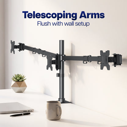 A 3-monitor desktop monitor arm with telescoping arms mounted on a white wall above a desk. The image includes the text 'Telescoping Arms Flush with wall setup' at the top, with a laptop, pen, small potted succulent, and mug on the desk.
