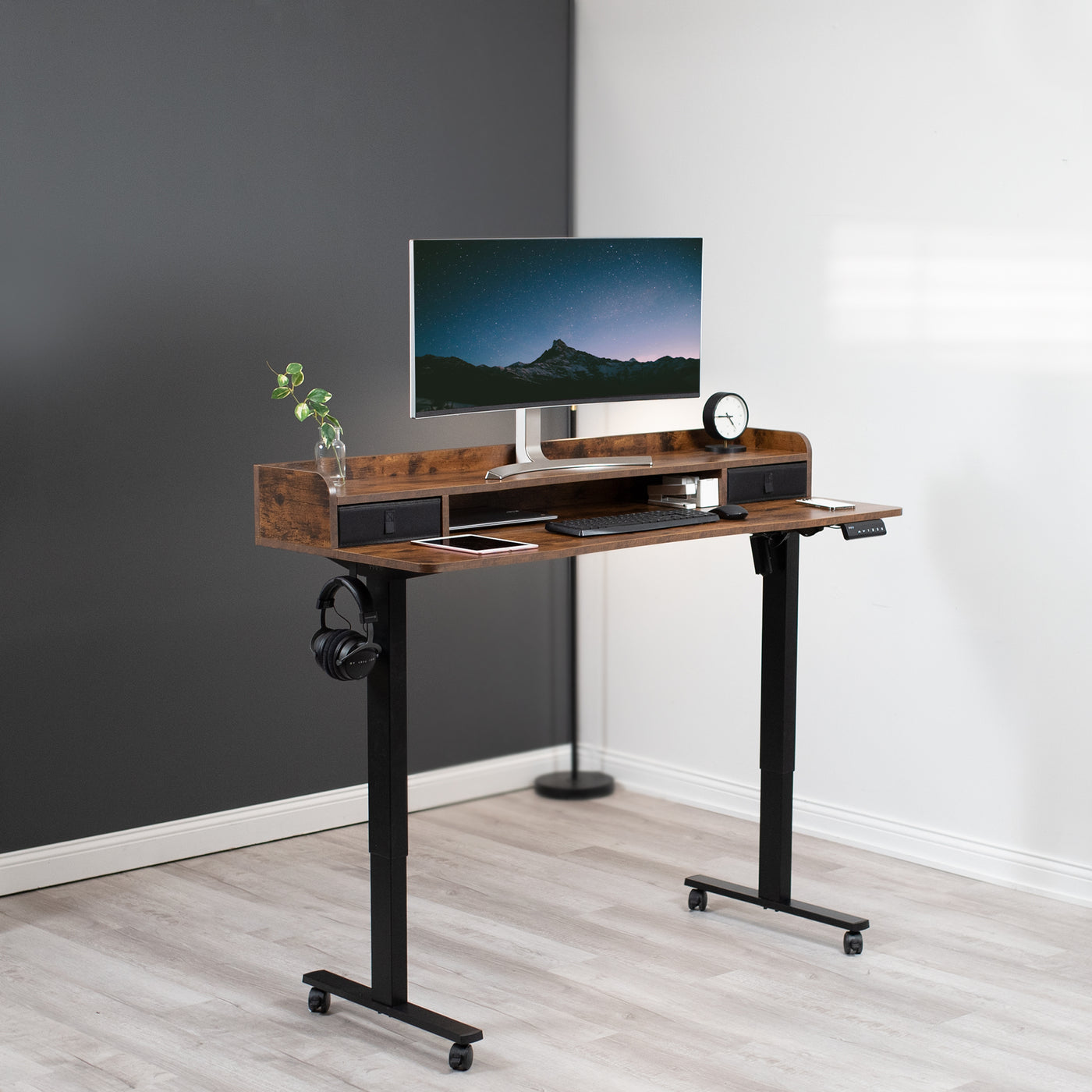 Rustic dual tier height adjustable mobile electric desk with storage drawers.