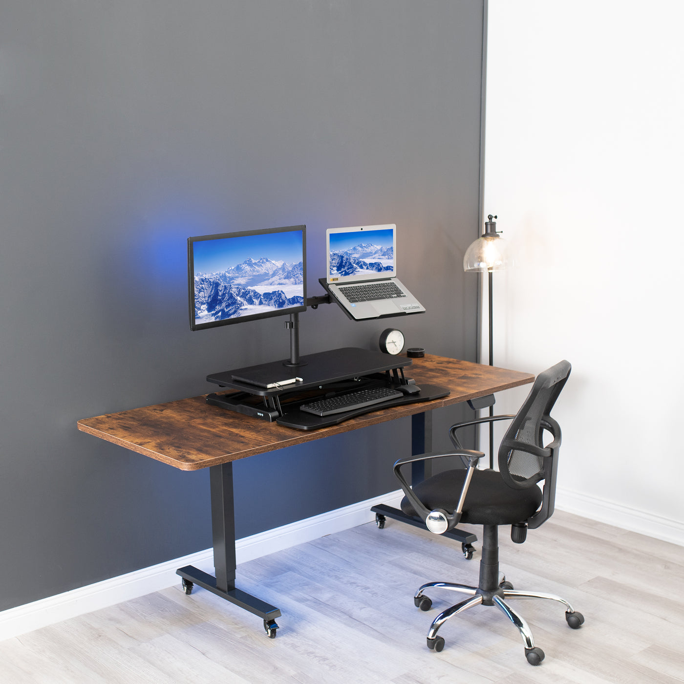 Desk riser with built-in monitor mount and laptop stand.