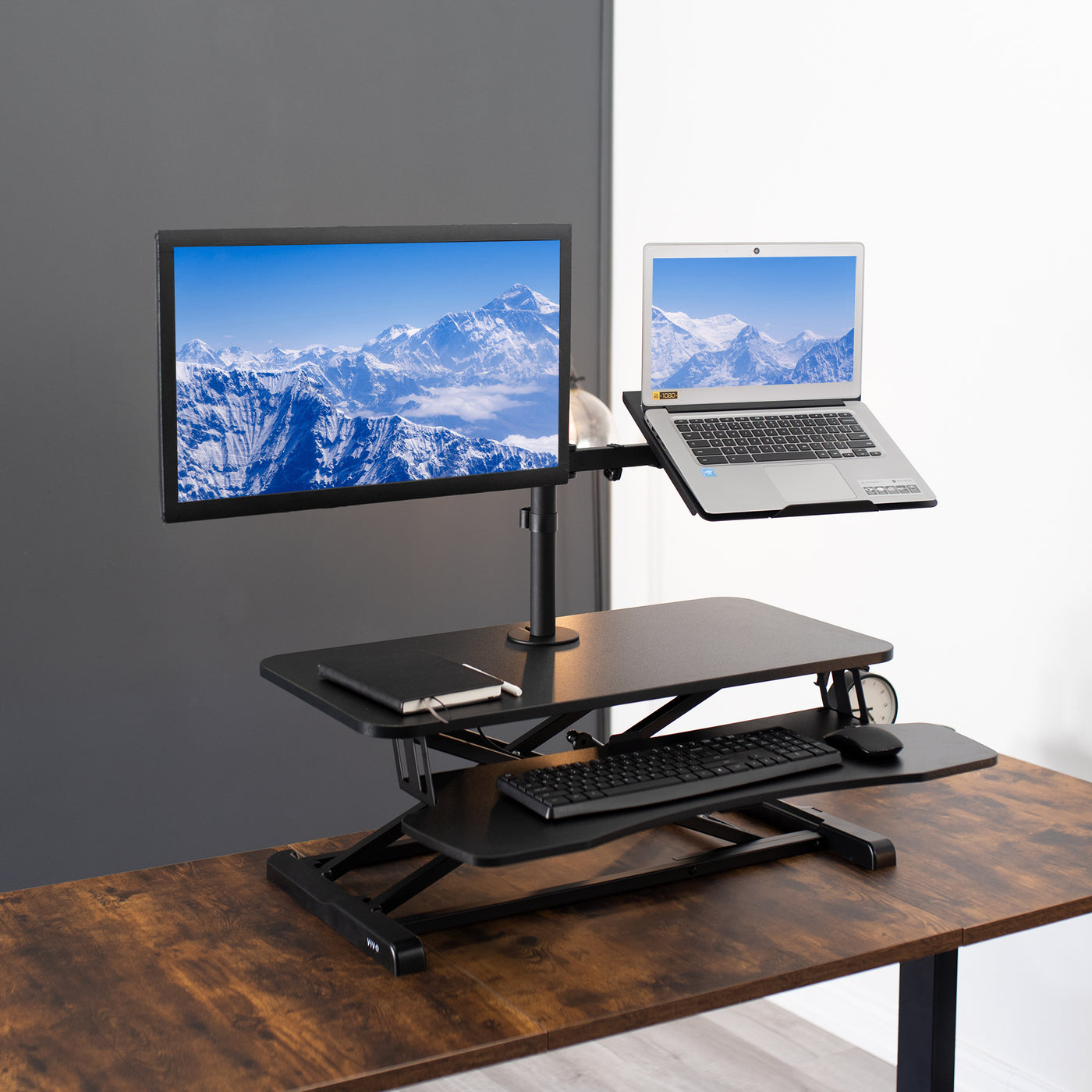 Modern desk riser on a table top creating an ergonomic workspace setup.