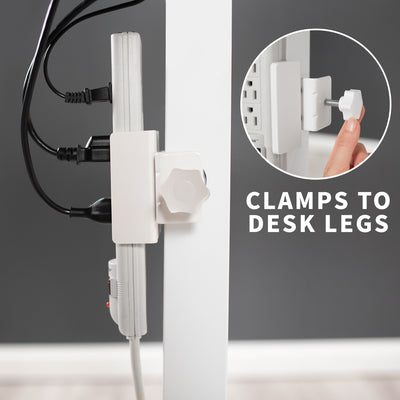 Power strip clamp attached to a modern desk frame leg.