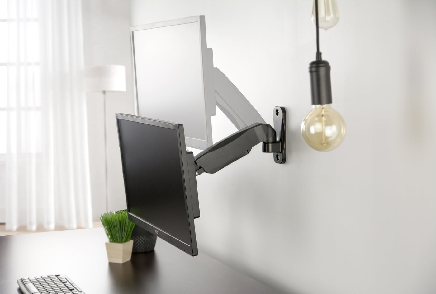 Sturdy adjustable pneumatic arm single monitor ergonomic wall mount for office workstation.