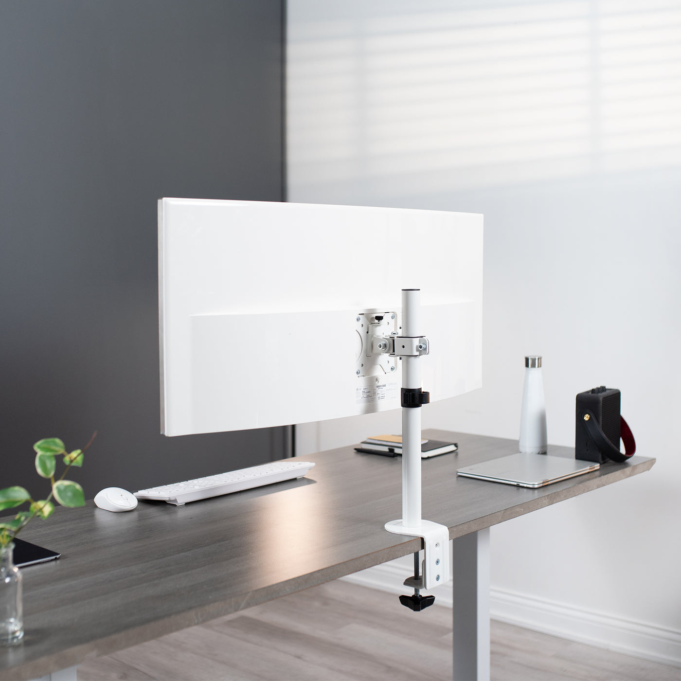 Sturdy adjustable single monitor ergonomic desk mount for office workstation.