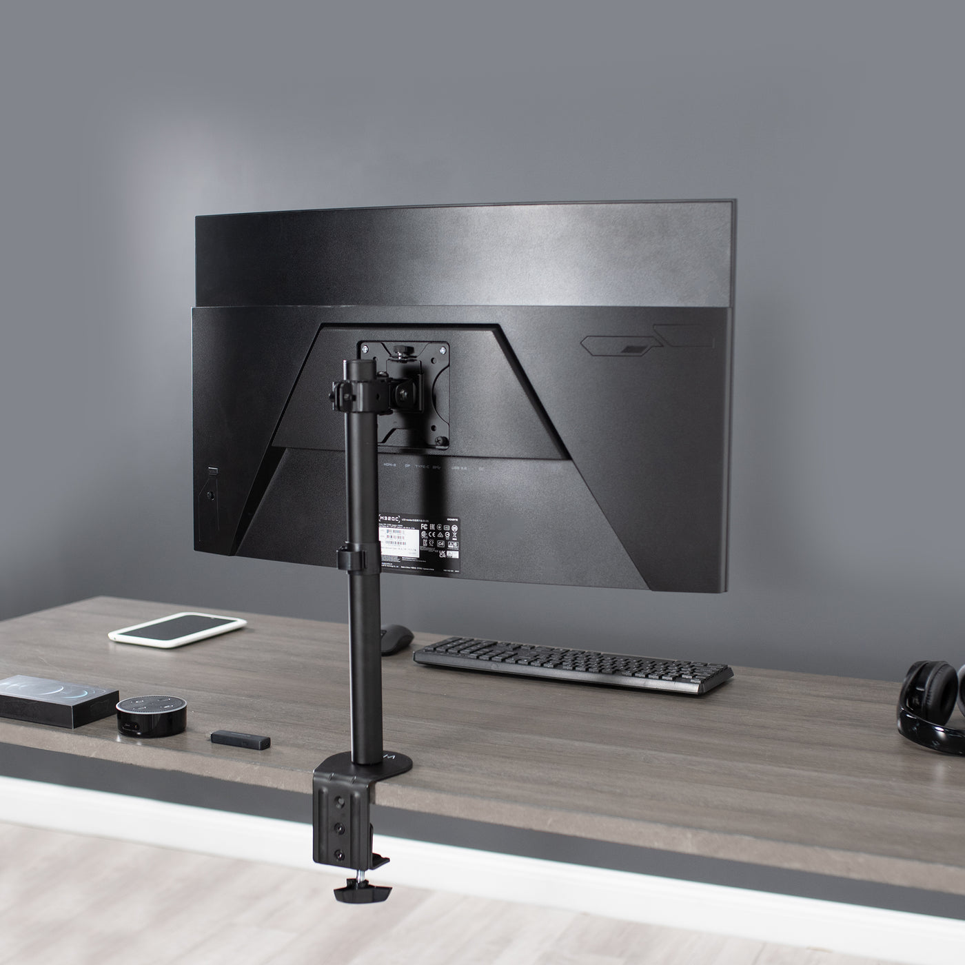 Sturdy adjustable single monitor ergonomic desk mount for office workstation.