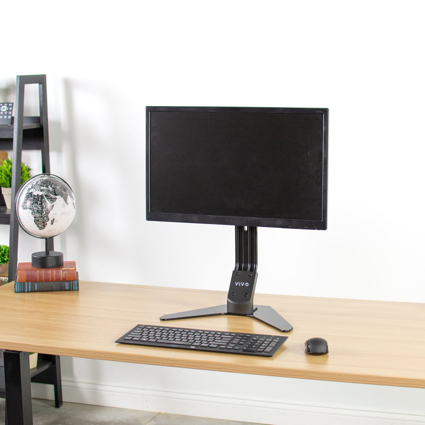 Top of desk monitor stand with slight vertical height adjustment.