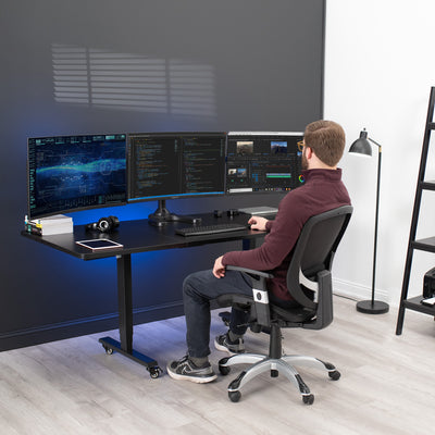 Sturdy height adjustable triple monitor desk stand.