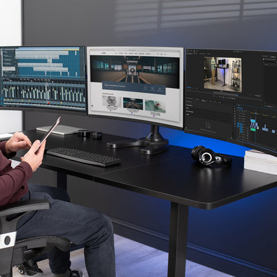 Sturdy height adjustable triple monitor desk stand.